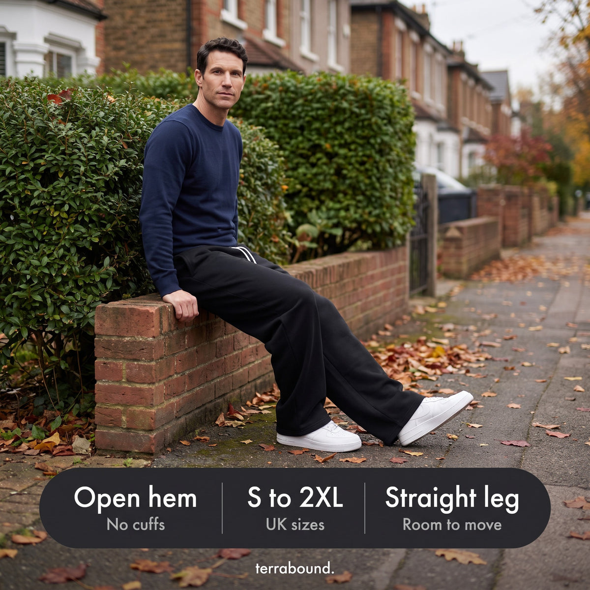 Man sitting on a garden wall in the joggers: open hem, sizes S to 2XL, straight leg