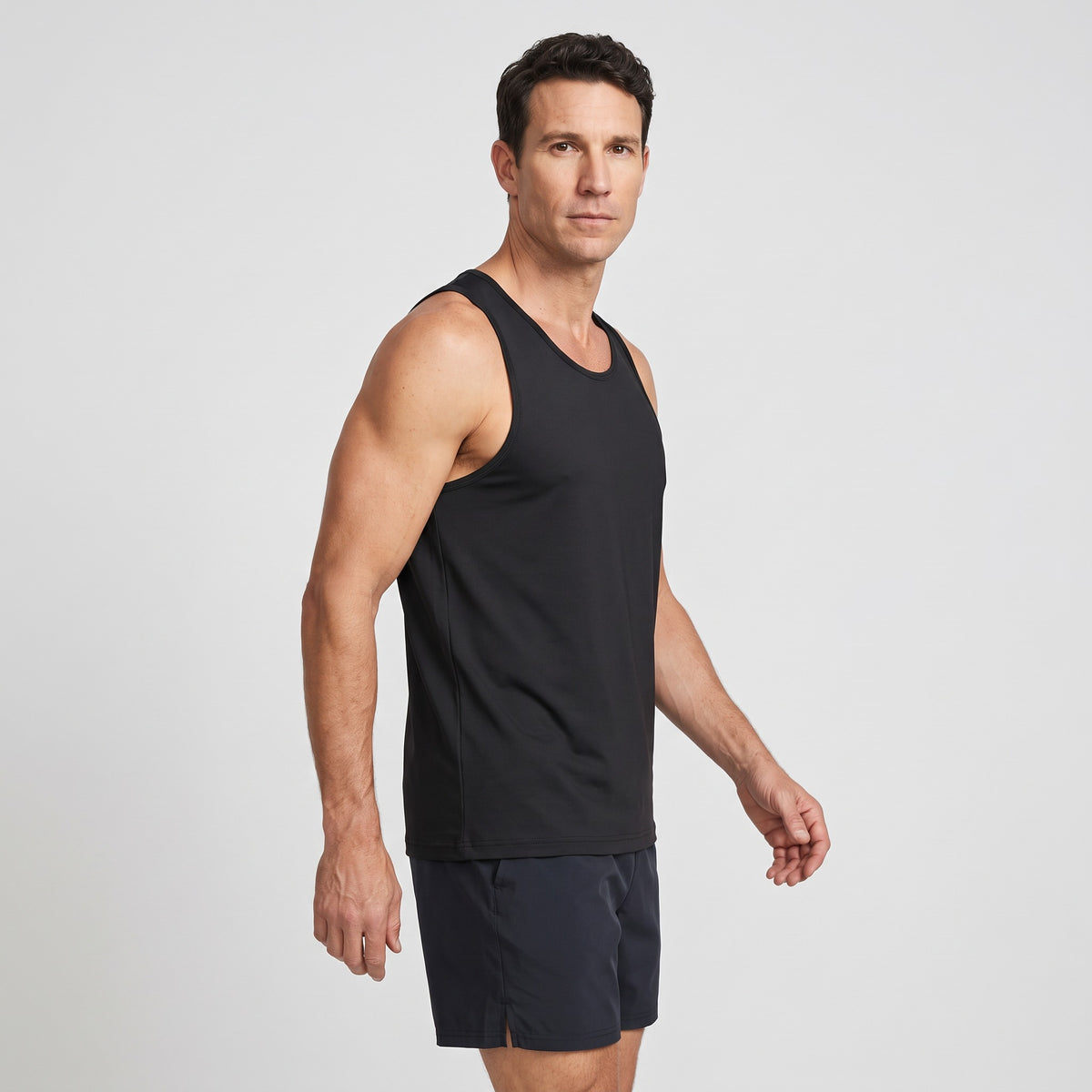 Side view of the men's running top showing the wide shoulder straps and armhole