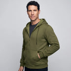 Three-quarter view of a man in the Army Green zip up hoodie, hand in the pocket