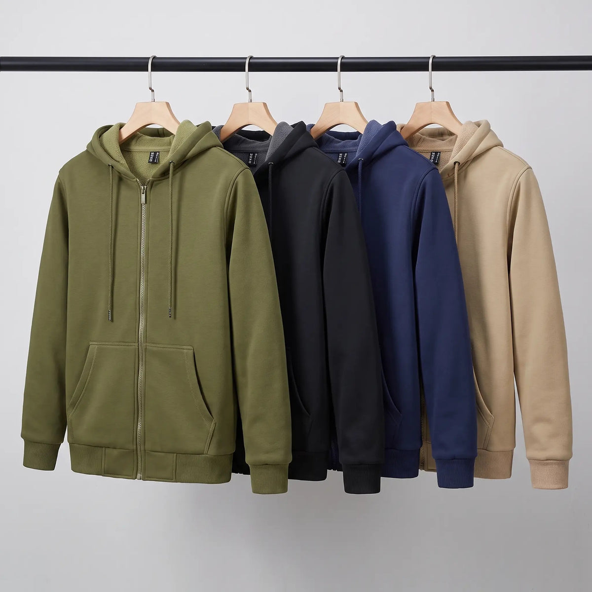 Men's zip up hoodies in Army Green, Black, Navy and Khaki on a rail