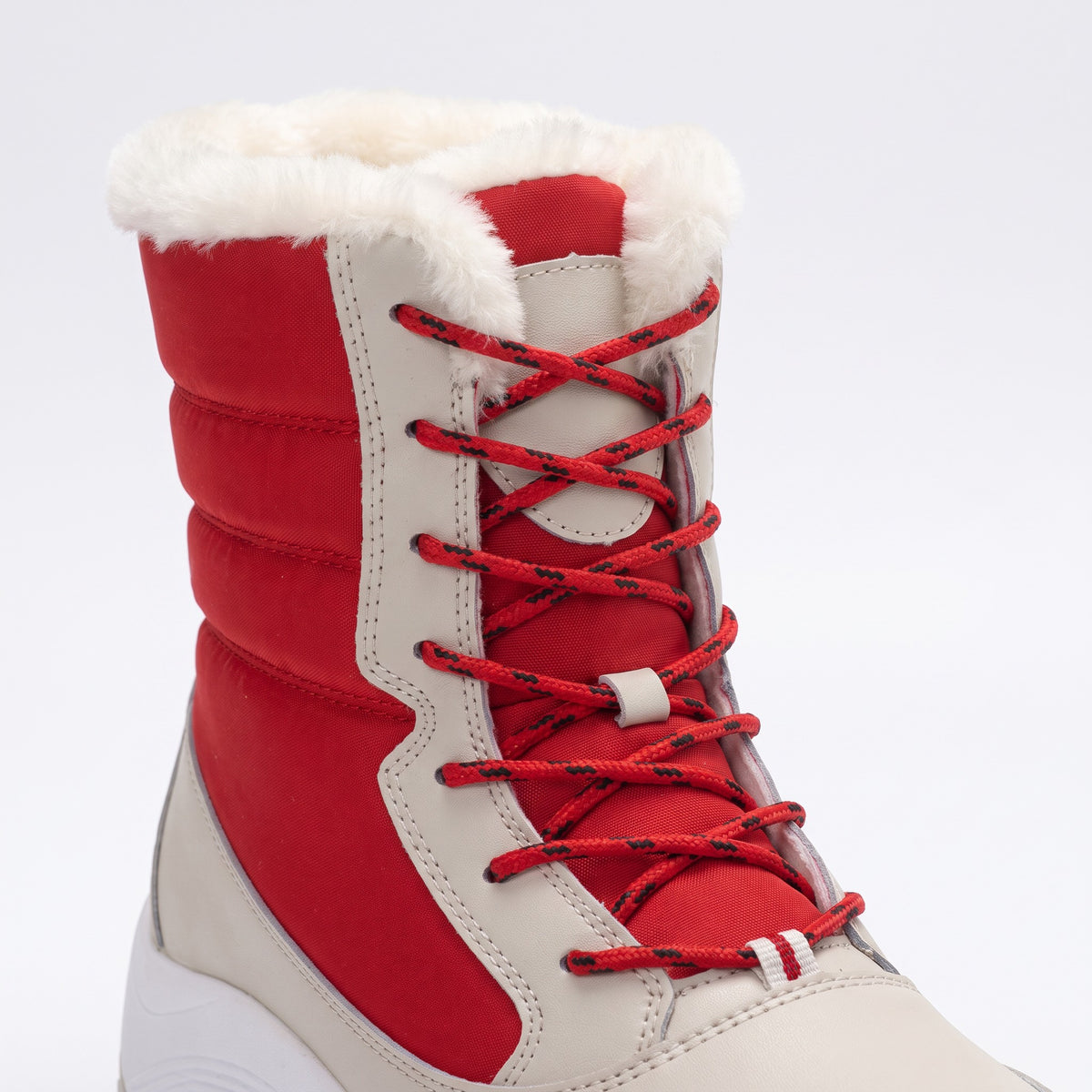 Close-up of the lace up front with eyelets, speed hooks and plush collar