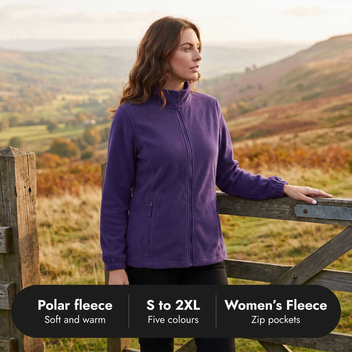 Woman at a hillside gate in the fleece: polar fleece, sizes S to 2XL, five colours, zip pockets