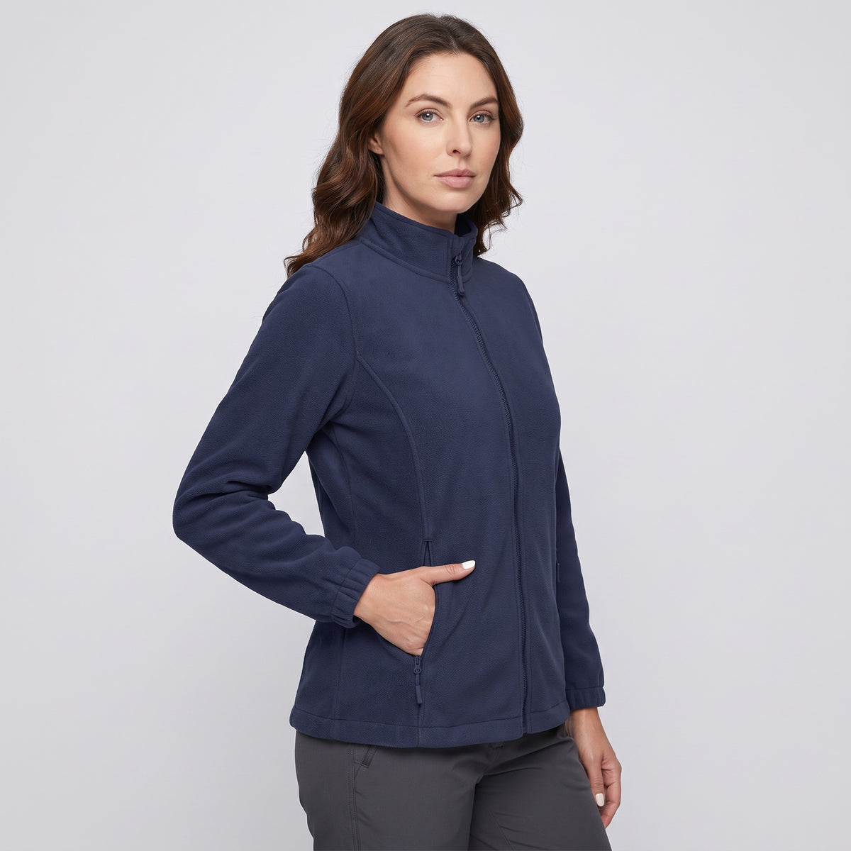 Women's fleece jacket in Navy, three-quarter view with a hand in a zip pocket