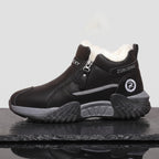 Side view of the chunky trainer sole with cushioned midsole and lugged chevron tread