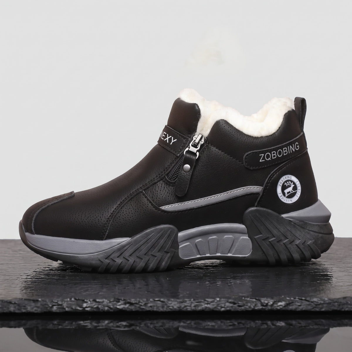 Side view of the chunky trainer sole with cushioned midsole and lugged chevron tread