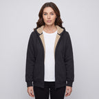 Woman wearing the Black sherpa lined zip up hoodie open over a white T-shirt, front view