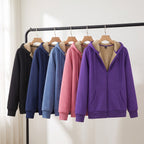 Sherpa lined zip up hoodie in Black, Navy, Grey Blue, Pink and Purple on a clothing rail