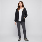 Full-length view of a woman wearing the Black sherpa zip up hoodie with trail shoes