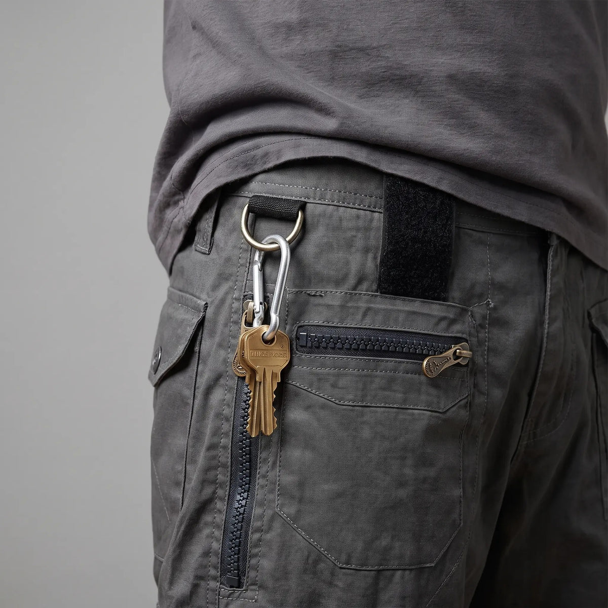 Keys clipped to the D-ring on the belt loop of the cargo shorts