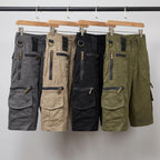Cargo shorts in grey, light brown, black and green on a rail