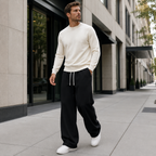 Man walking in town wearing the baggy straight leg joggers in Black
