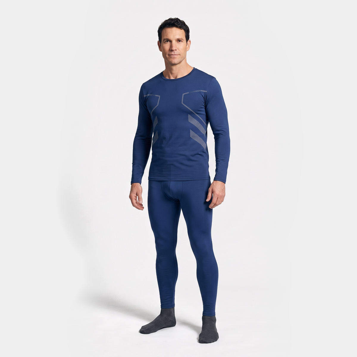 Man wearing the navy long johns set, long sleeve top and leggings, full length studio view