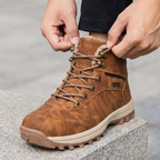 Lacing the men's winter boot through the metal speed hooks