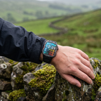 Smart watch worn on a walker's wrist resting on a drystone wall in the Yorkshire Dales