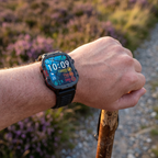Smart watch showing steps, calories and heart rate on a hand gripping a walking pole