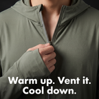 Close-up of a hand lowering the zip to vent, thin reflective trim beside the zip