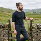 Man by a stile in the Yorkshire Dales wearing the Terrabound tactical belt in Blue