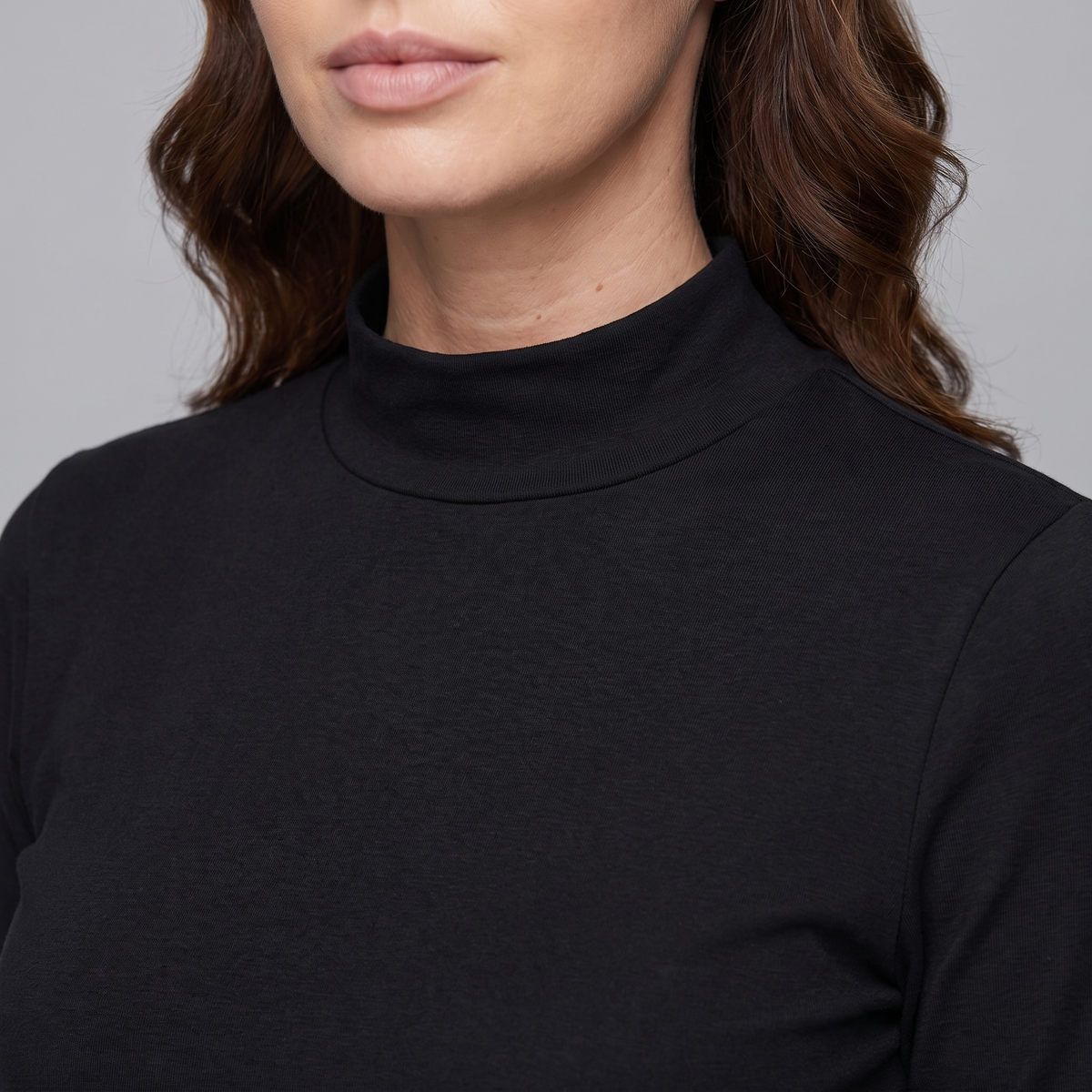 High stand-up collar of the women's thermal top close up