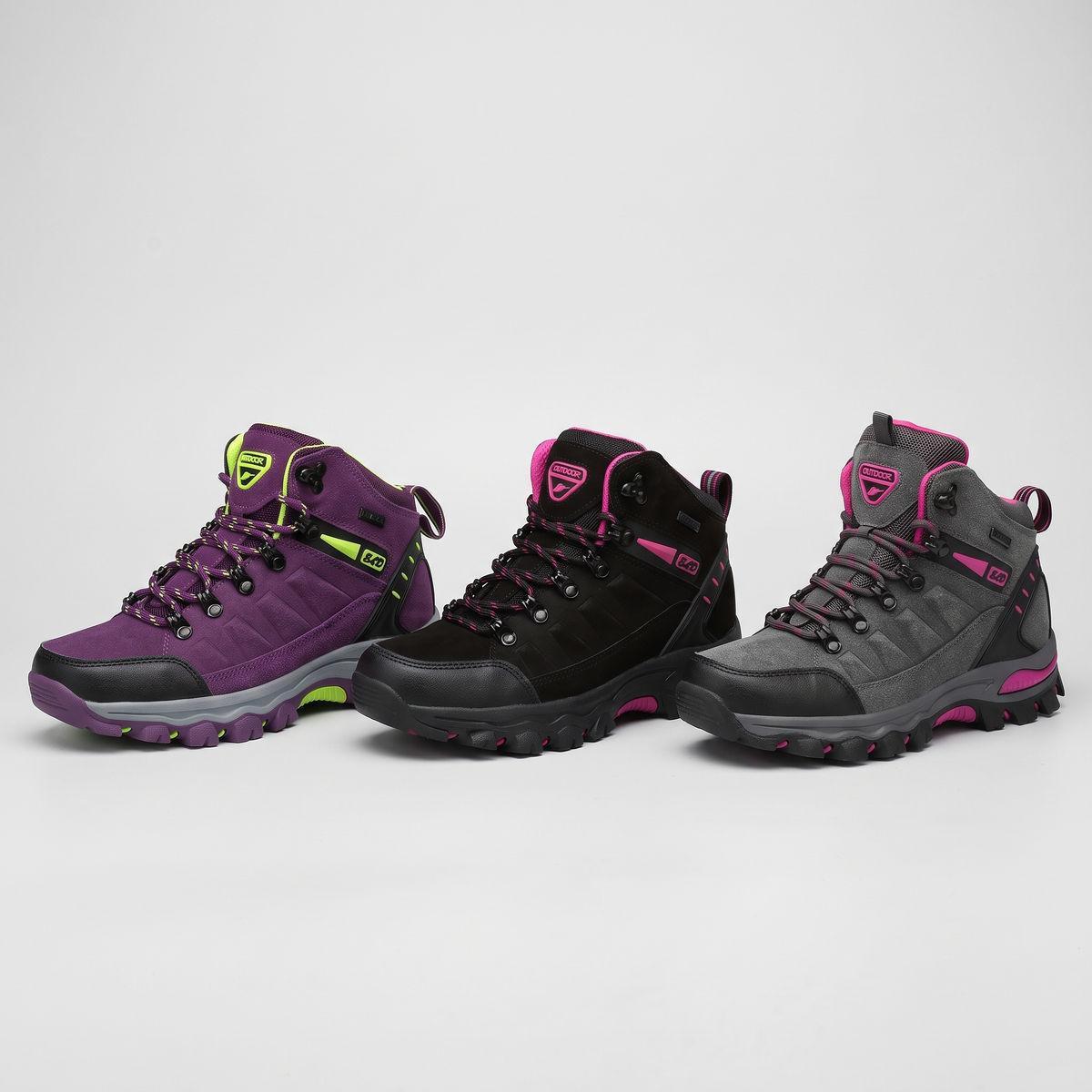 Women's walking boots in purple, black and grey side by side