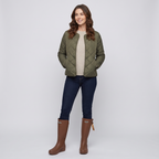 Woman wearing the women's knee high wellies in Brown with jeans tucked in