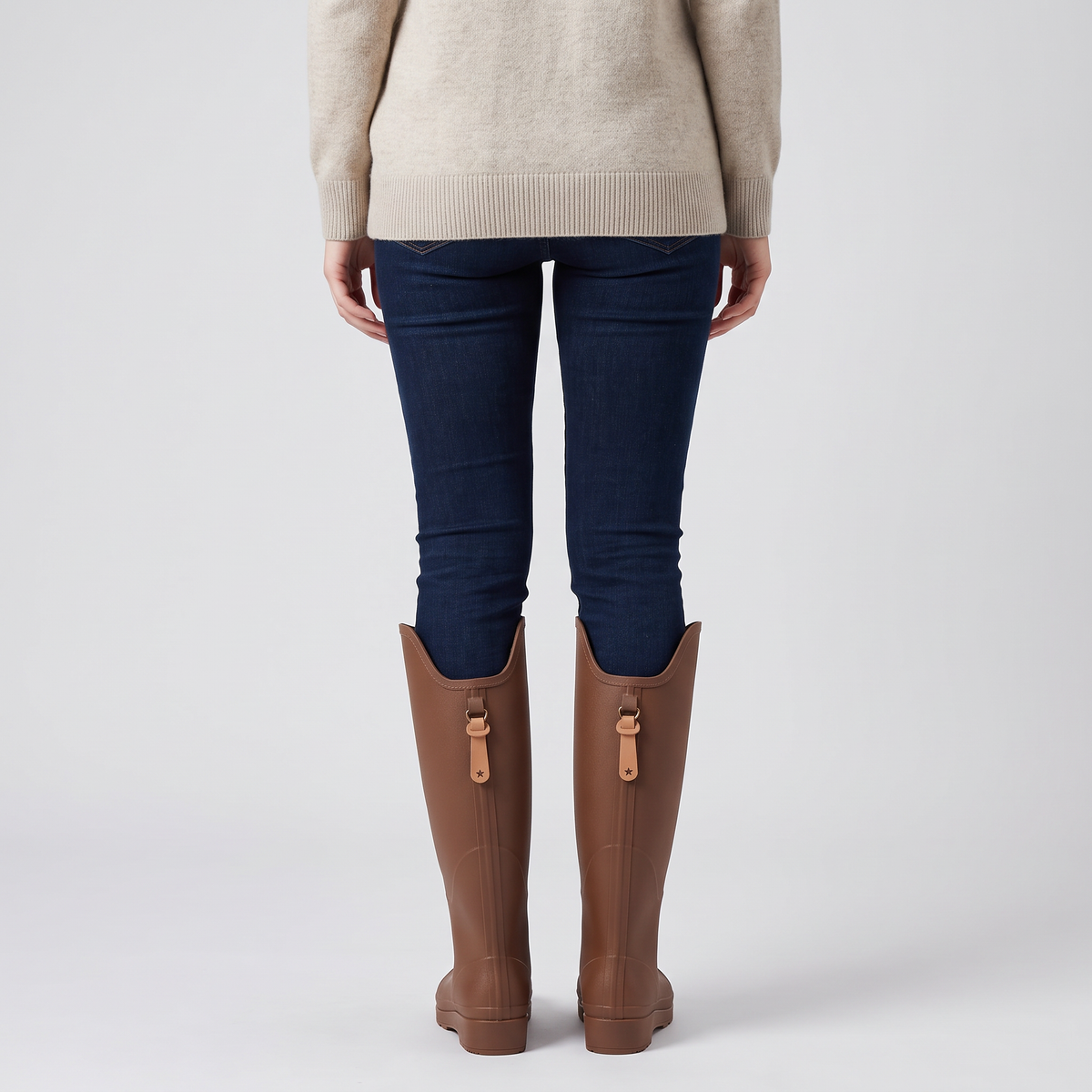 Back view of the women's knee high wellies worn, showing the pull tabs