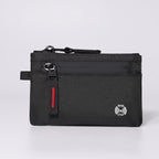Terrabound zip card holder in Black Red, front view on grey