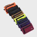 Zip card holder in eight colours fanned out: orange, black, black red, tan, lime, navy, purple, raspberry