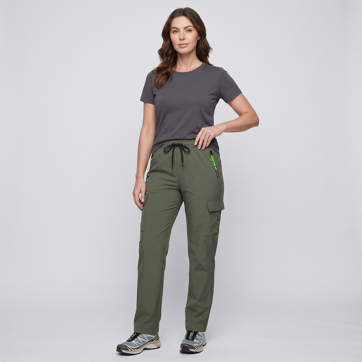 Woman wearing the Terrabound women's cargo trousers in green, full length