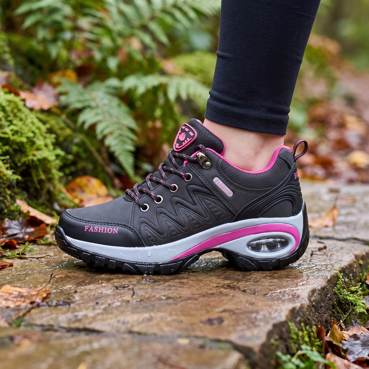 Terrabound women's walking shoes planted on a wet stone on a woodland trail